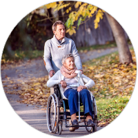 Caregiver with a senior woman on a wheelchair 
