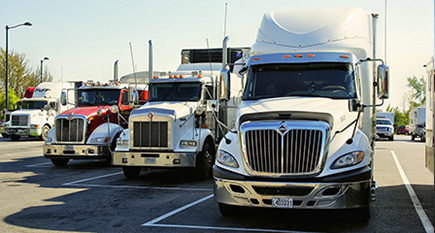 Four Commercial Trucks